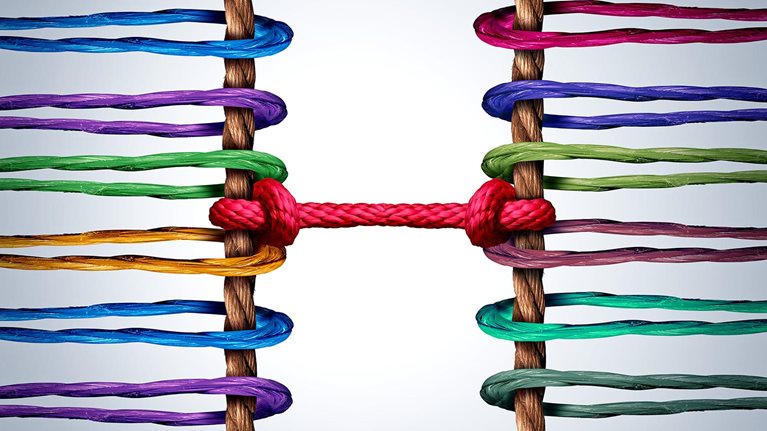 Image of two groups of ropes linked and tied together by a central rope as symbolizing connection and mediation between groups.